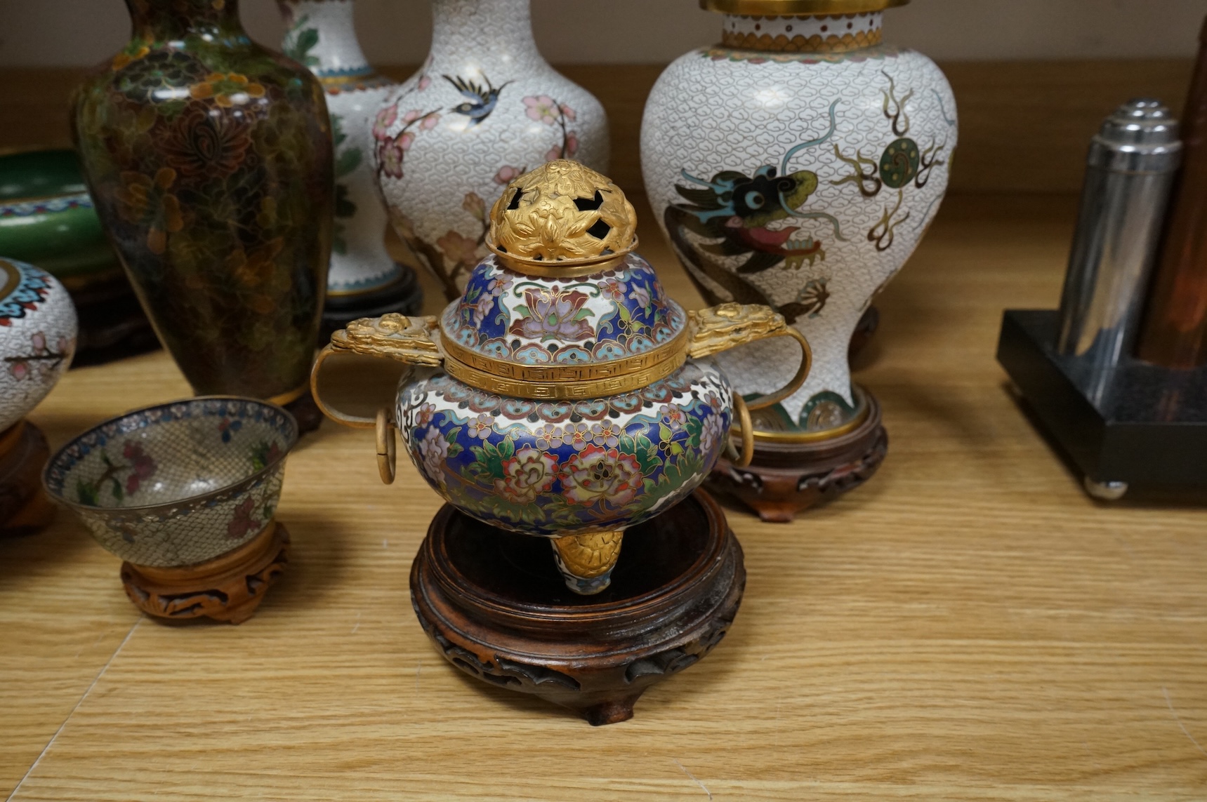 A plique a jour enamel tea bowl together with a collection of cloisonné enamel vases, bowls etc., tallest 26cm